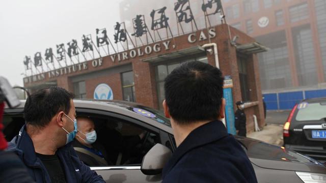 Members of the World Health Organization team investigating the origins of the coronavirus arrive by car at the Wuhan Institute of Virology on Feb. 3, 2021. 
