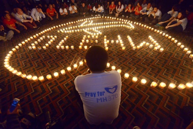 Chinese relatives of passengers on missing Malaysia Airlines flight MH370 take part in a prayer service at the Metro Park Hotel in Beijing, China, April 8, 2014