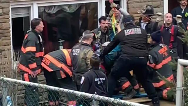 First responders rescue a man from a trench outside a Yonkers home. 