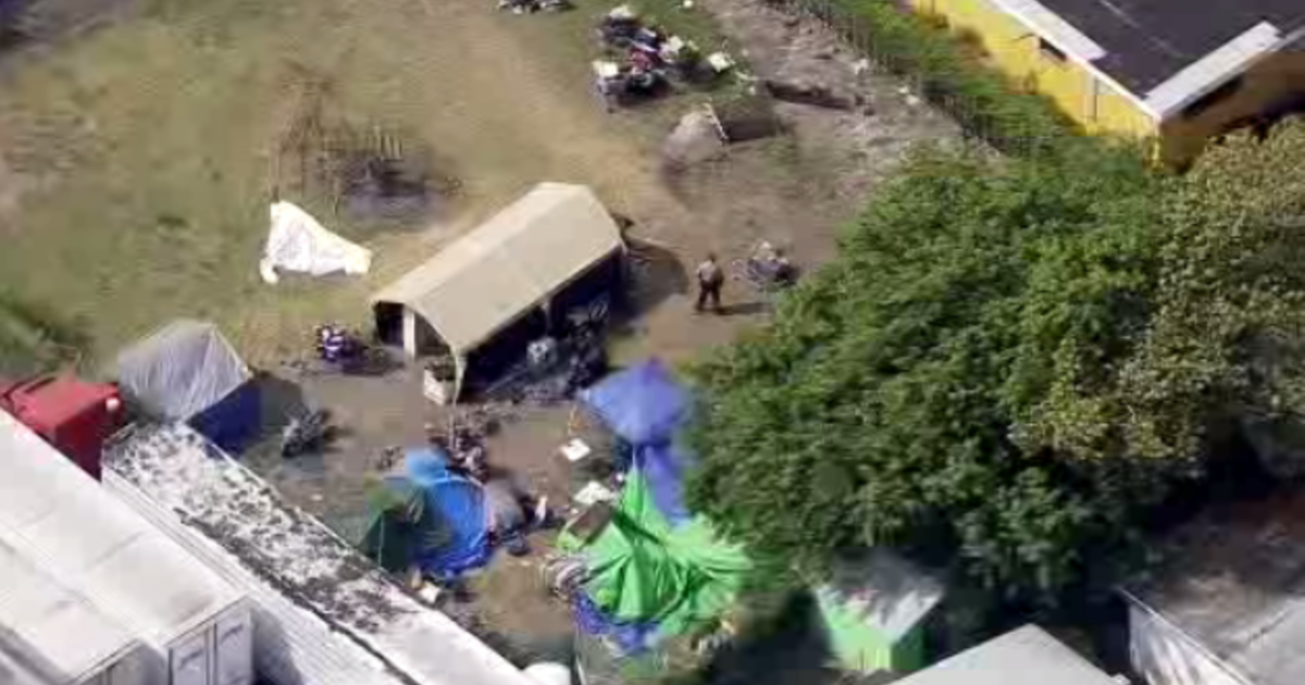 Law enforcement investigating fatal taking pictures at NW Miami-Dade encampment