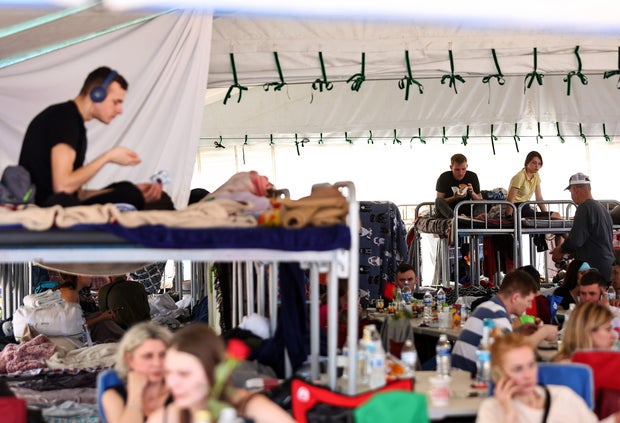 Ukrainians who are seeking asylum in the United States gather in a city government shelter for Ukrainians on April 7, 2022, in Tijuana, Mexico.