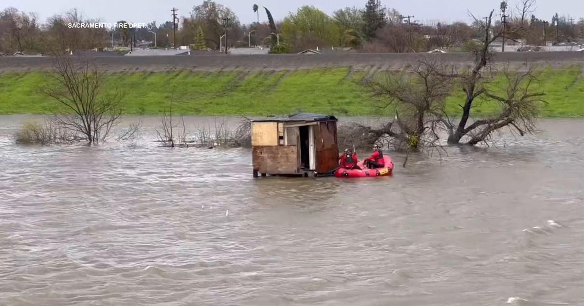 2 people, dog rescued after their makeshift shelter in North Sacramento gets surrounded by water