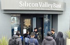 A worker tells people that the Silicon Valley Bank (SVB) headquarters is closed on March 10, 2023 in Santa Clara, California. 