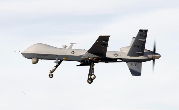 A MQ-9 Reaper drone flies by during a training mission at Creech Air Force Base on November 17, 2015, in Indian Springs, Nevada
