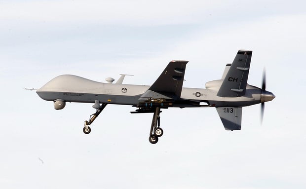 A MQ-9 Reaper drone flies by during a training mission at Creech Air Force Base on November 17, 2015, in Indian Springs, Nevada.