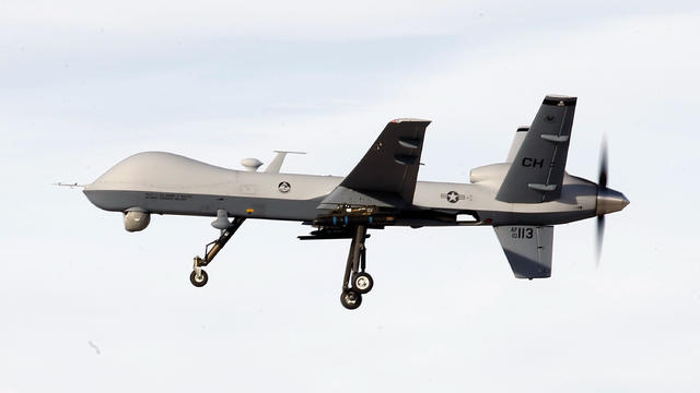 A MQ-9 Reaper drone flies by during a training mission at Creech Air Force Base on November 17, 2015, in Indian Springs, Nevada. 