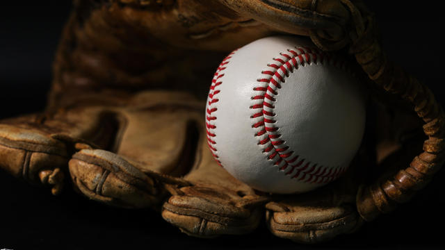 Glove and baseball on a black background, no background people are excellent. 
