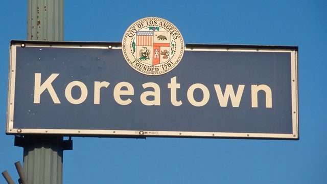A city sign that says Koreatown 