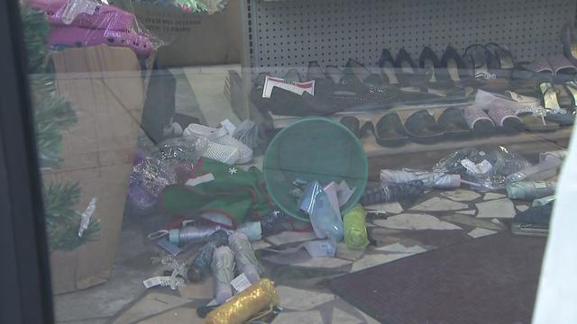 Merchandise knocked to the ground inside a store. 