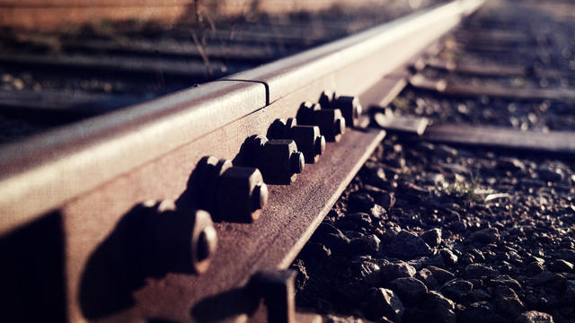 Close-Up Of Nut And Bolts On Rusty Railroad Track 