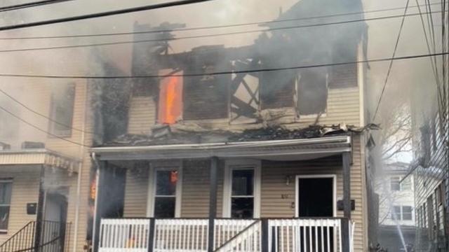 Fire destroys the top floor of a two-story home. 