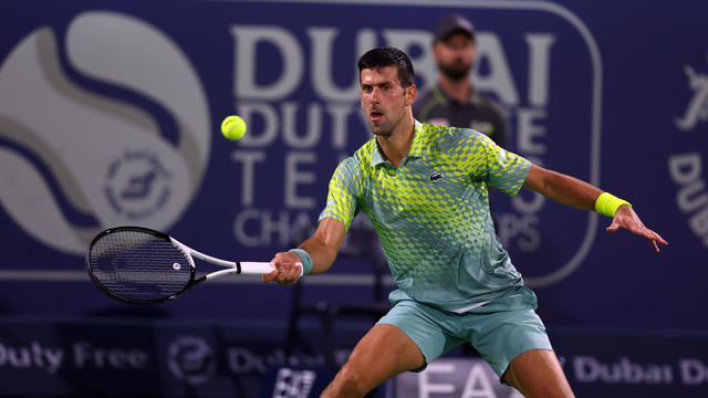 Novak Djokovic in action against opponent in Dubai tournament 