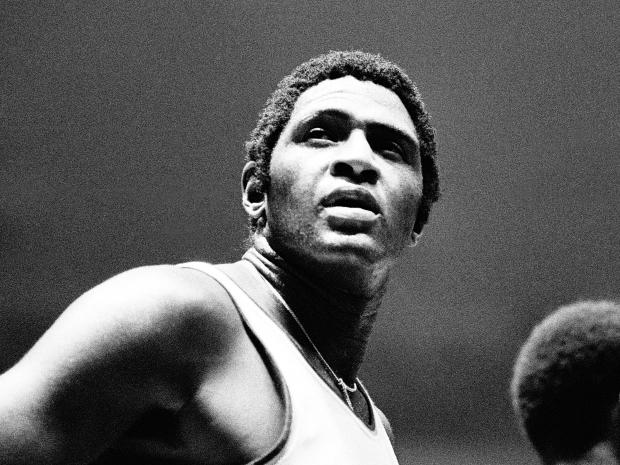 Willis Reed, center of the New York Knicks, takes a brief pause to look at the scoreboard during an NBA basketball game against the Buffalo Braves in Madison Square Garden on October 16, 1973, in New York. 