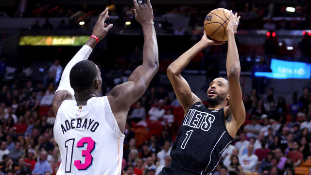 Mikal Bridges #1 of the Brooklyn Nets shoots the ball over Bam Adebayo #13 of the Miami Heat during the first quarter of the game at Miami-Dade Arena on March 25, 2023 in Miami, Florida. 