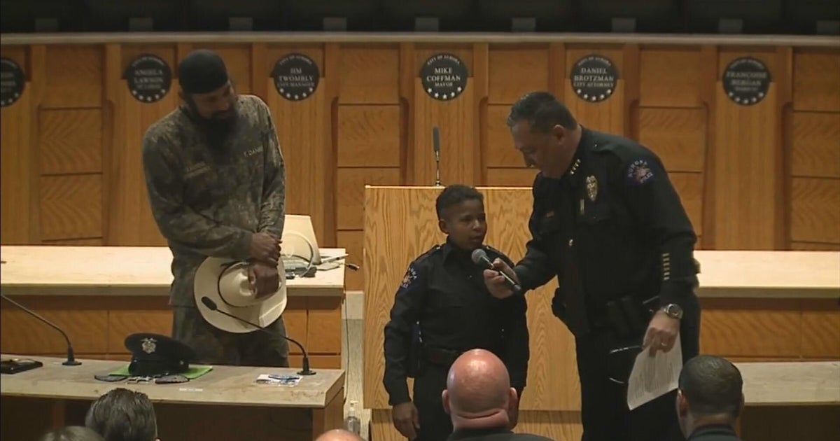 Cancer warrior Devarjaye "DJ" Daniel sworn in as honorary Aurora police