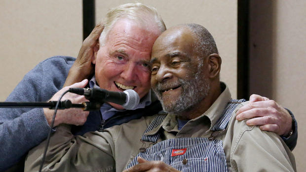 (Boston, MA - 3/21/17) Former Boston Mayor Ray Flynn, left, and former state Rep. Mel King embrace during the launch of of Boston Peace and Democracy Discussions in Roxbury, Tuesday, March 21, 2017. Staff photo by Angela Rowlings. 