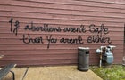FILE PHOTO: A threat is spray painted on the building wall near Wisconsin Family Action's offices in Madison 