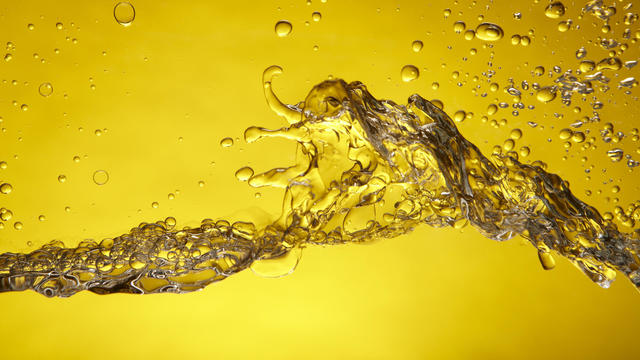 A splash of water over a yellow background 