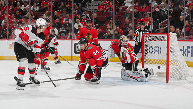 Erik Haula #56 of the New Jersey Devils scores on goalie Alex Stalock #32 of the Chicago Blackhawks in the second period at United Center on April 01, 2023 in Chicago, Illinois. 