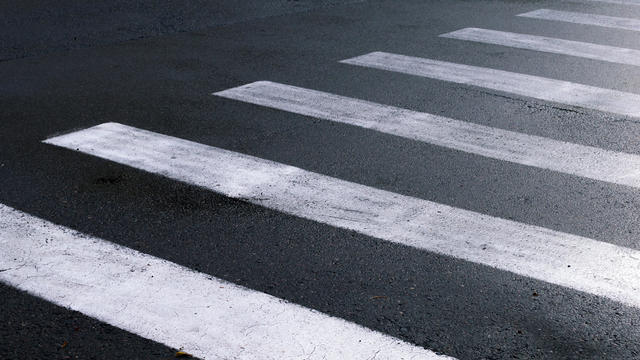 Crosswalk on city street closeup 