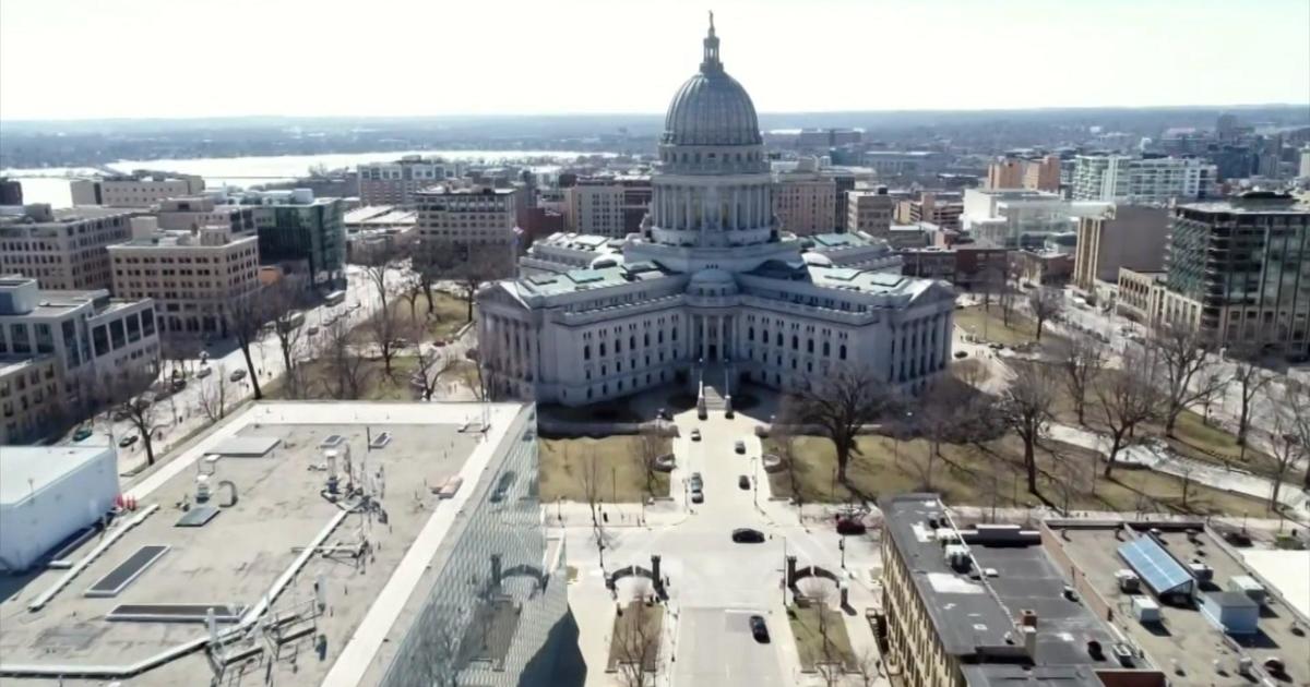 A man with a gun was arrested at the Wisconsin Capitol after asking to see the governor. He returned with an assault rifle.