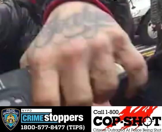 A surveillance photo of a suspect accused of shooting an NYPD officer.