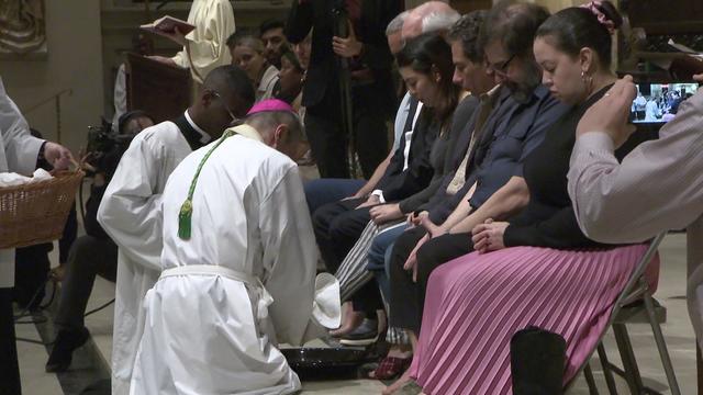Catholics had their feet washed at Cathedral Basilica of St. James on Holy Thursday. 