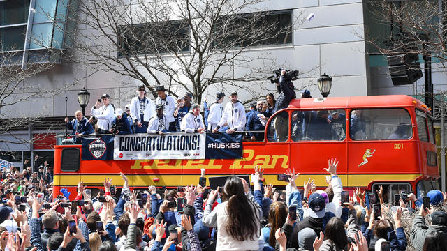 The UConn Huskies open-top bus arrives for the rally during the UConn Championship Parade on April 8, 2023, at the XL Center in Hartford, CT. 
