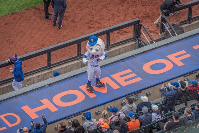 Mr Met seen dancing on the bleechers. Mets fans and climate 