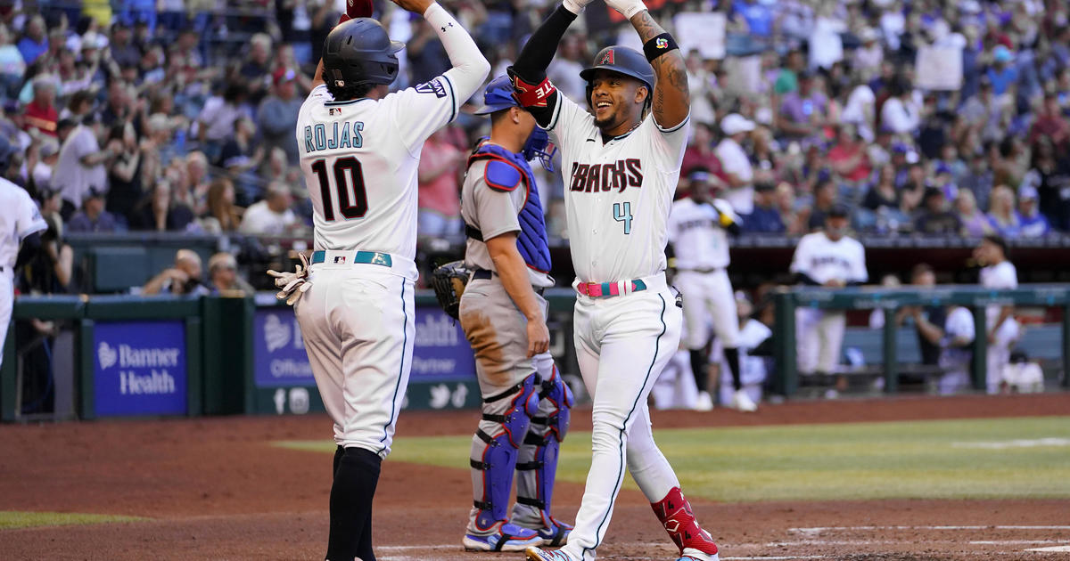 Diamondbacks' Pavin Smith and Josh Rojas near the finish line for