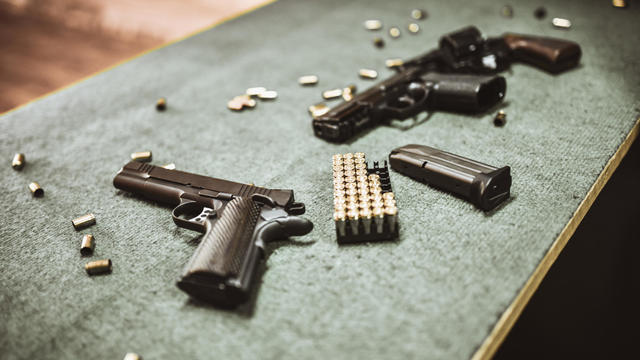 Modern Pistols And Gun Cartridges At Gun Training Range 