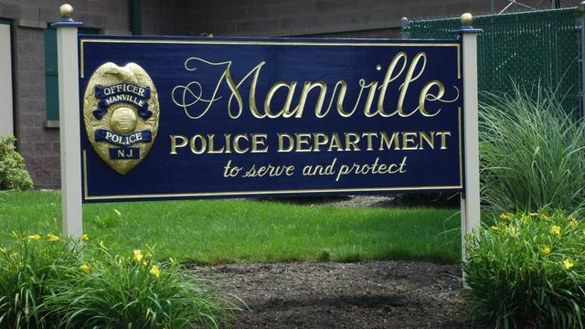 A sign for the Manville Police Department. 