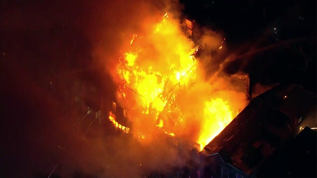 Flames consume a two-story building. 