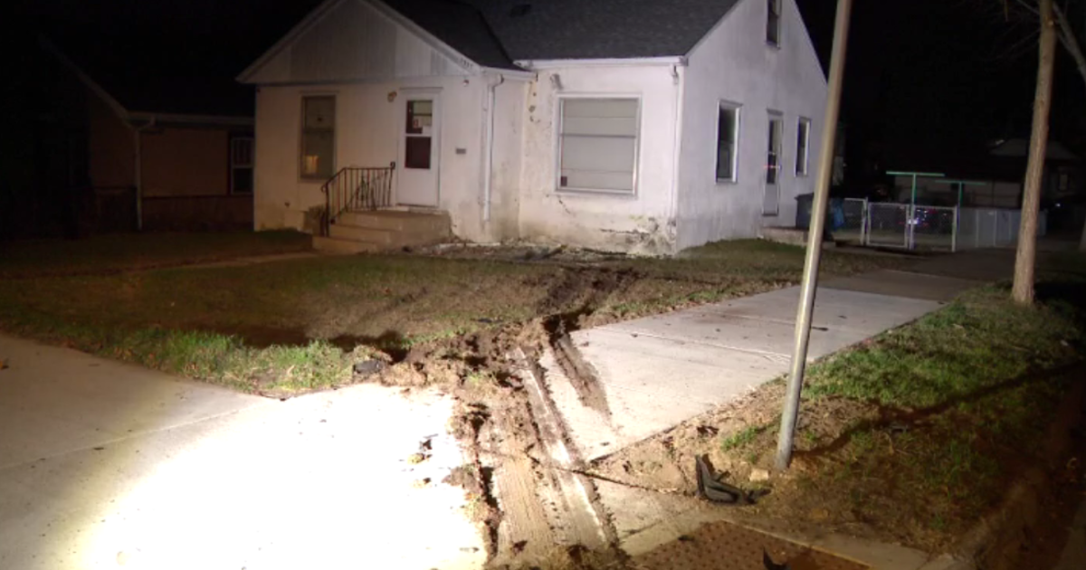 Stolen car crashes into north Minneapolis house; 2 injured