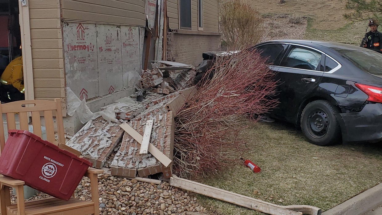 Driver hospitalized after crashing into garage in Lakewood - CBS Colorado