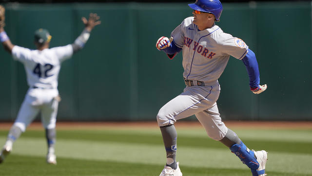 Brandon Nimmo #9 of the New York Mets races into second base with an RBI double against the Oakland Athletics in the top of the sevent inning at RingCentral Coliseum on April 15, 2023 in Oakland, California. All players are wearing the number 42 in honor 