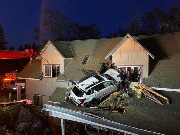 A car crashed into the second story of a home, injuring one person 