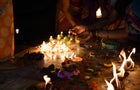 Close-Up Of Hand Holding Illuminated Candles Hindu Religious Activity for Dev Diwali Festival in Varanasi 