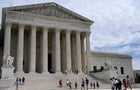 People walk outside the Supreme Court in Washington on April 14, 2023. 