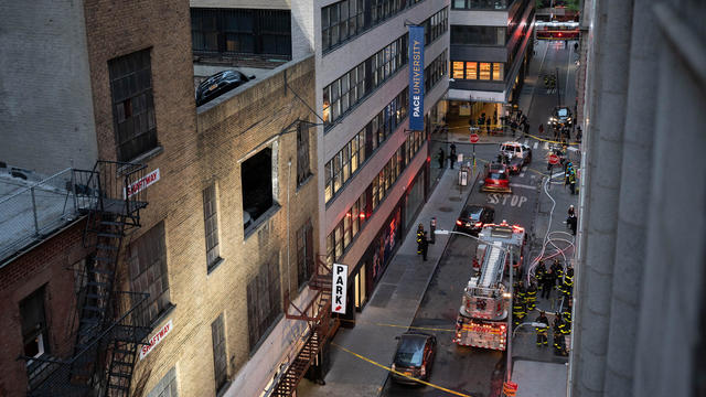 Firefighters inspect the partially collapsed parking garage in Manhattan, New York, United States on April 18, 2023. 