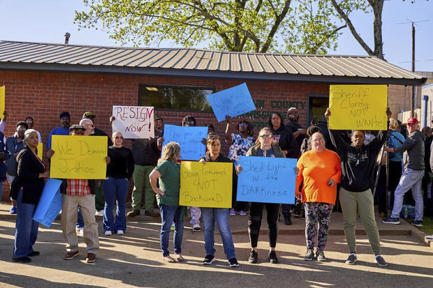 In this photo provided by the Southwest Ledger, McCurtain County residents call for the resignation of several McCurtain County officials after tapes with the officials' racist comments surfaced over the weekend, in Idabel, Okla., Monday, April 17, 2023.