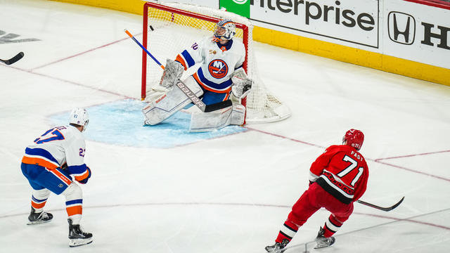 Jesper Fast #71 of the Carolina Hurricanes scores the game-winning goal in overtime against the New York Islanders in Game Two of the First Round of the 2023 Stanley Cup Playoffs at PNC Arena on April 19, 2023 in Raleigh, North Carolina. 