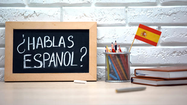 Do you speak Spanish written on board, international flag in box, language 