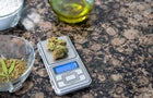 Cooking with cannabis: table with digital scale to calculate the dose of marijuana and ingredients. Copy space right. 