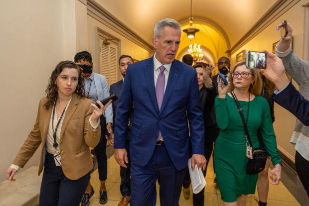 Speaker of the House Rep. Kevin McCarthy is followed by members of the media as he walks in the U.S. Capitol on April 26, 2023. 
