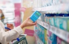 Woman choosing products in drugstore 