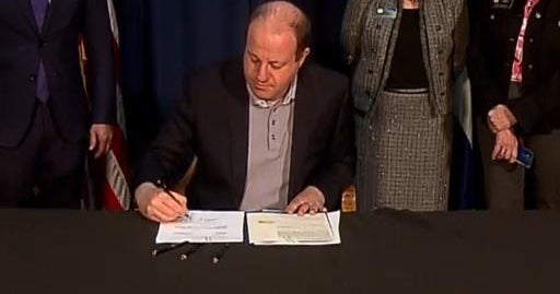 Gov. Jared Polis signs 2 new school safety bills into law - CBS Colorado