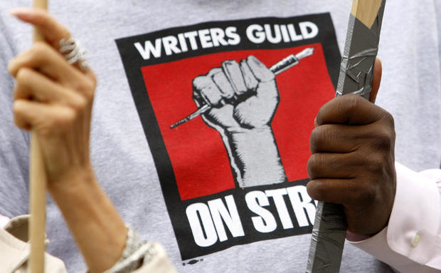Member of Writers Guild of America hold signs on a picket line in Los Angeles 