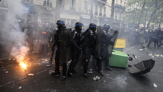 Police attend protests during Labor and Solidarity Day on May 1, 2023 in Paris, France. 