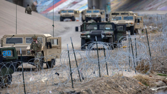 Texas National Guard soldiers stand guard at the U.S.-Mexico border on Jan. 7, 2023, as viewed from Ciudad Juárez, Mexico. 